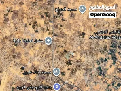 أرض تجارية 9200 متر بعد مثلث القيو على الرئيسي — عين زارة